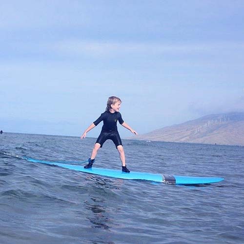 kids are surfing in private surf lessons in maui